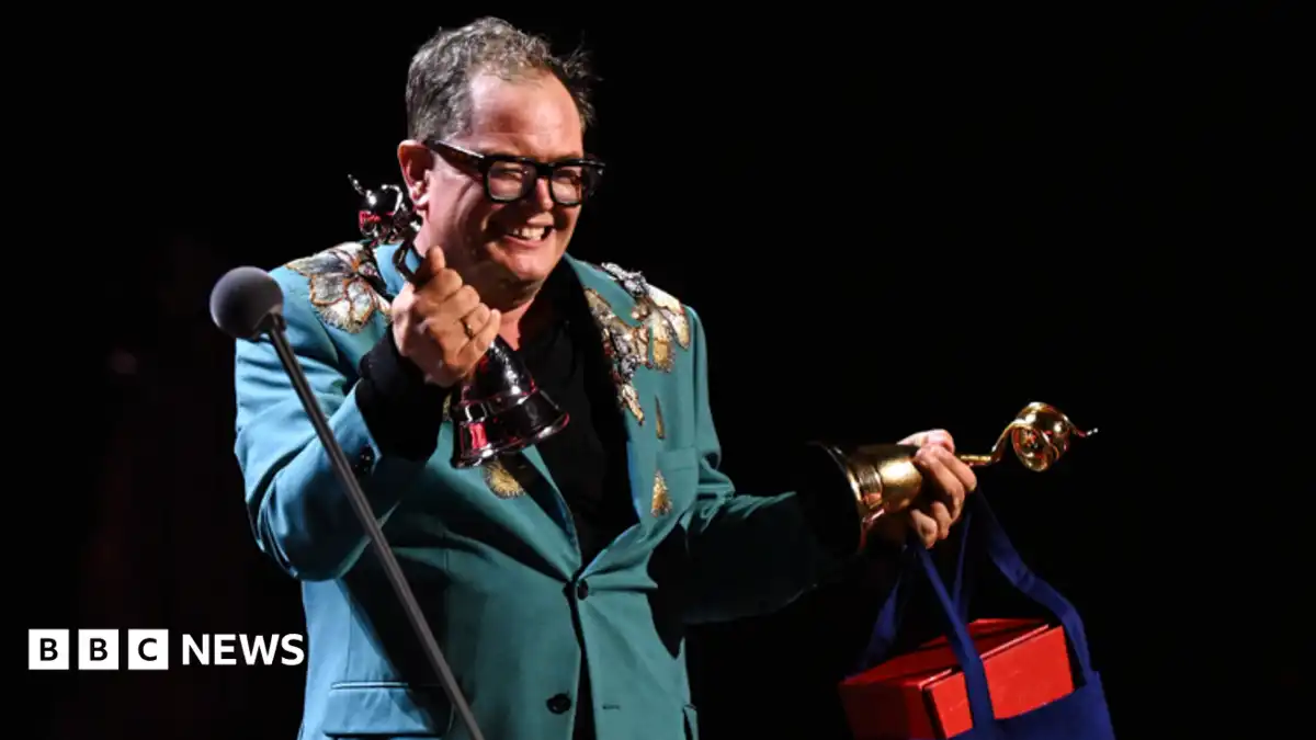 Alan Carr holds back tears on special night at National Television Awards