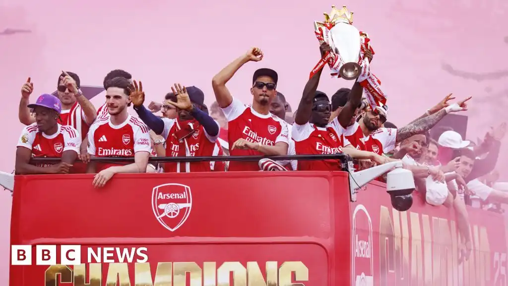 Arsenal fans line London streets in Premier League victory parade
