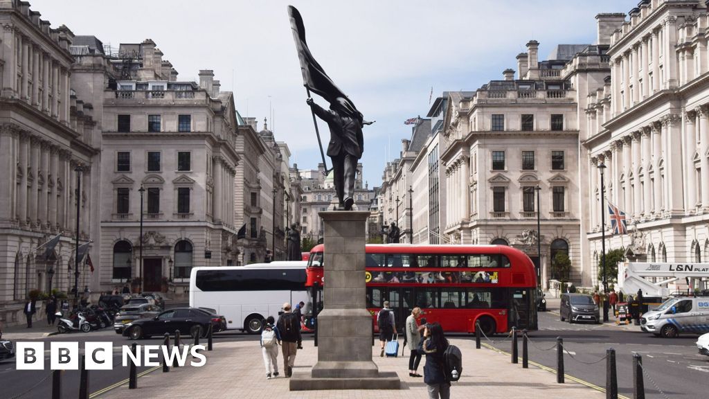 Banksy's signature appears on new statue in central London