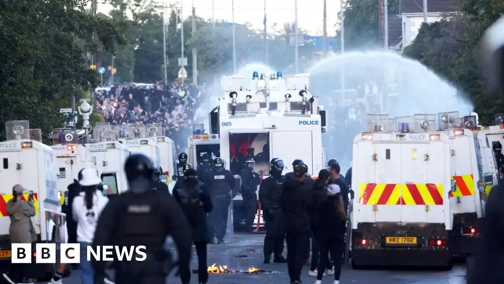 Belfast attack: Water cannon fired in latest disorder after stabbing