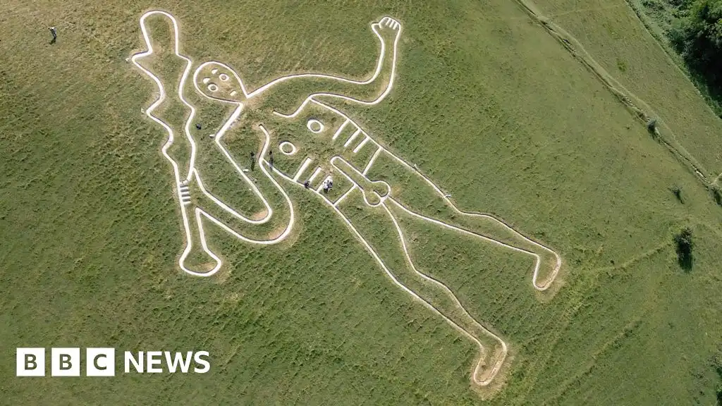 Britain's rudest chalk figure gets a glow-up to stop it fading in the rain