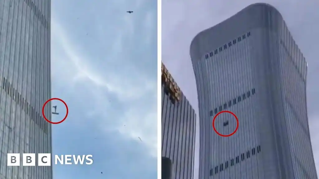 China: Debris falls after plane hits Beijing's tallest building