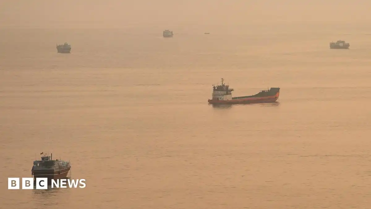 Container ship sinks in Strait of Hormuz after being hit by projectile, Singapore says