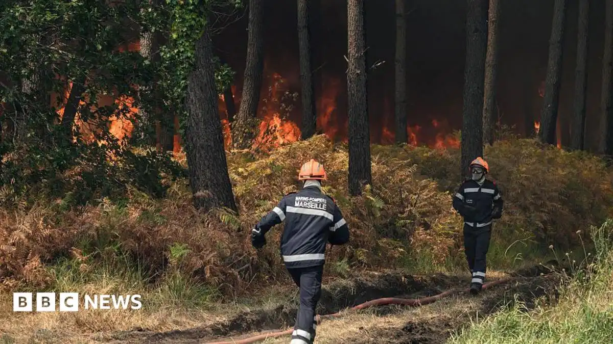 France wildfire crews face searing heat in battle to contain flames
