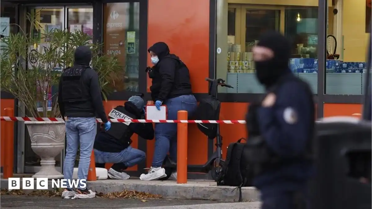 Macron says deadly shooting near Paris is a 'racist terrorist attack'