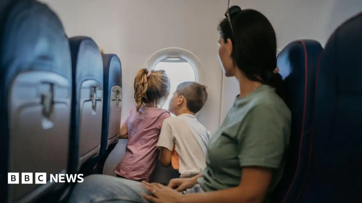 Move to stop charges for parents to sit by children on flights