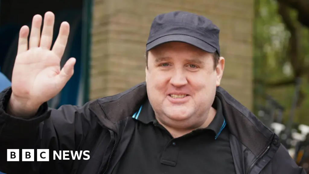 Peter Kay bomb hoax accused removed from court during hearing