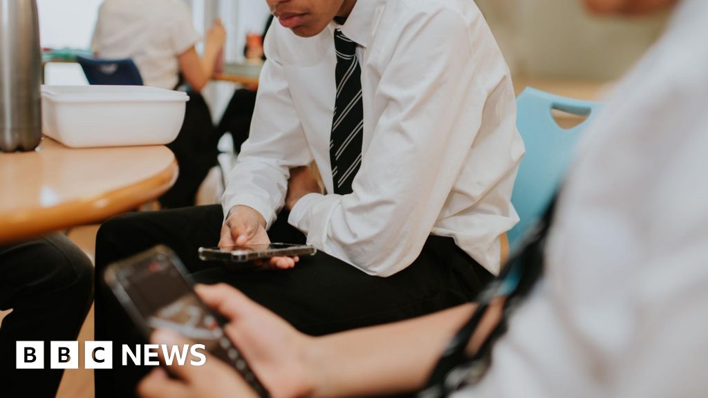 Phones to be banned in schools by law in England under government plans