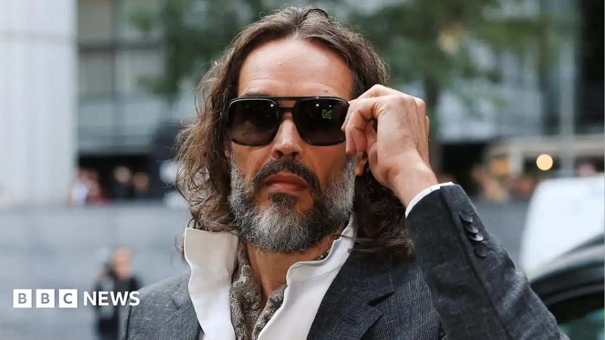 Russell Brand appears in court for start of rape trial
