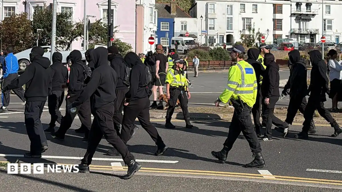 Use all powers necessary on anti-migrant protests, home secretary tells police