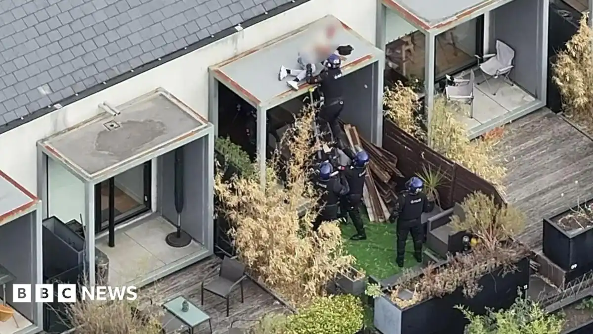 Watch as police arrest wanted man while he slept on Salford roof