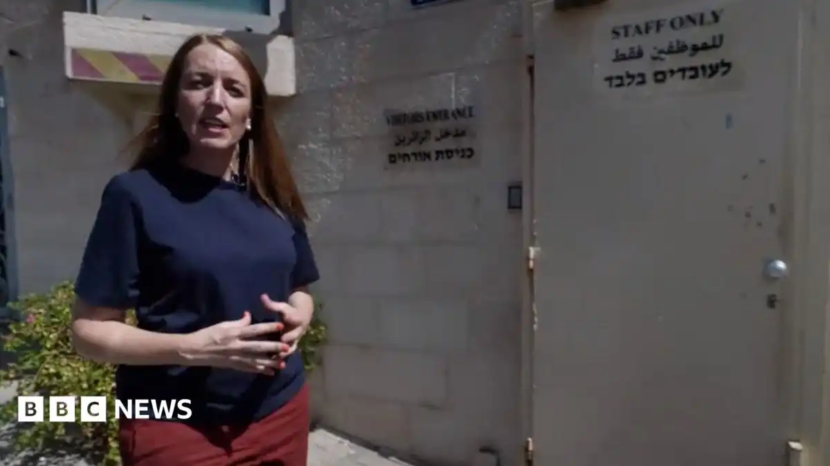 Why was the sign at the British consulate in East Jerusalem removed?