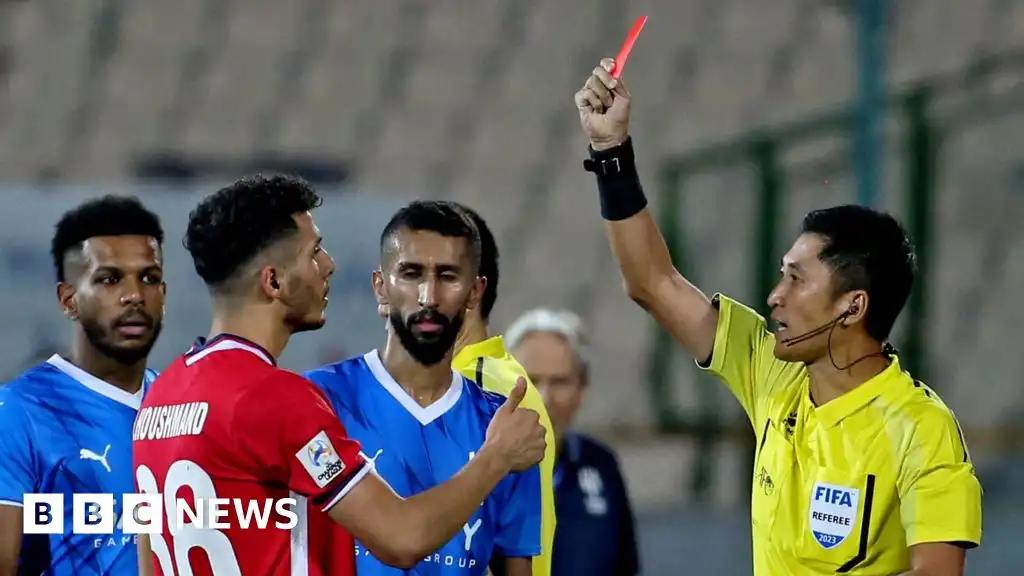 With no team on field, China fans pin hopes on World Cup referee